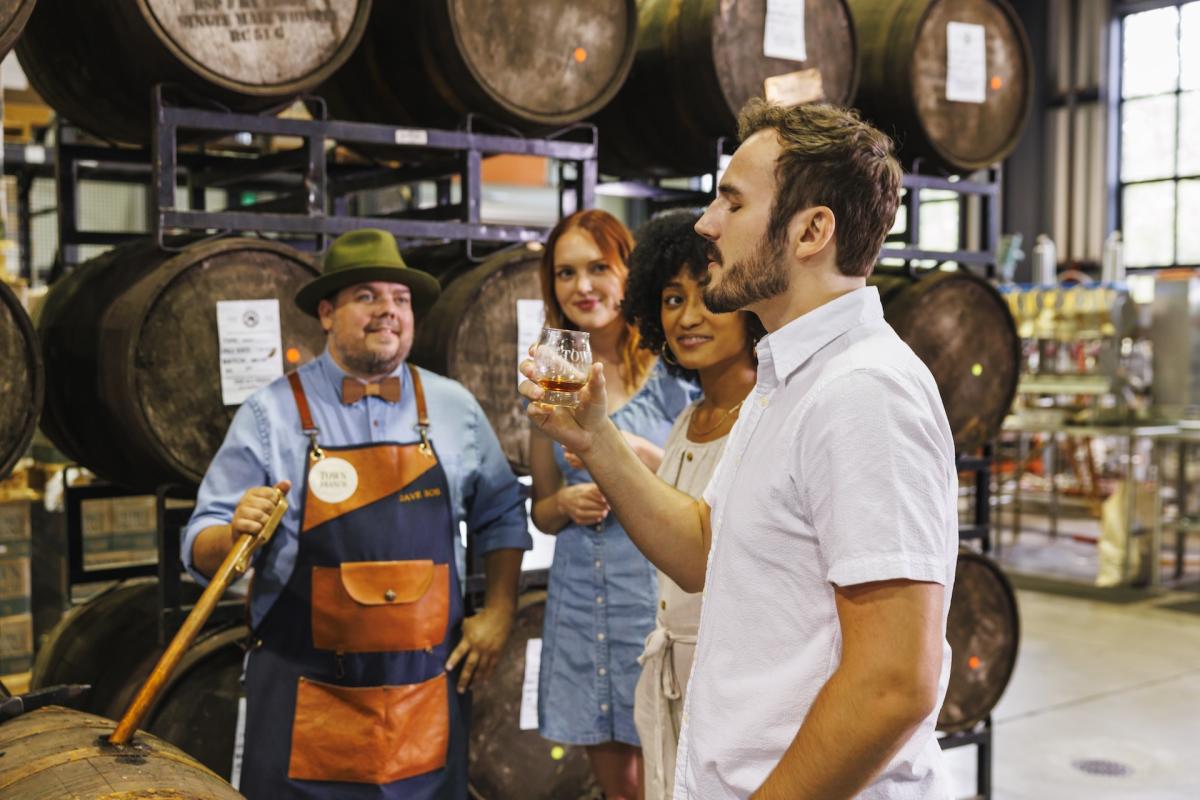 Group of people trying bourbon on the Brewgrass Trail
