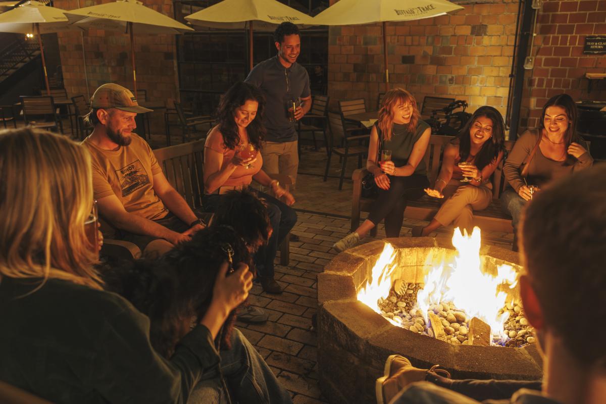 Group hanging around a firepit