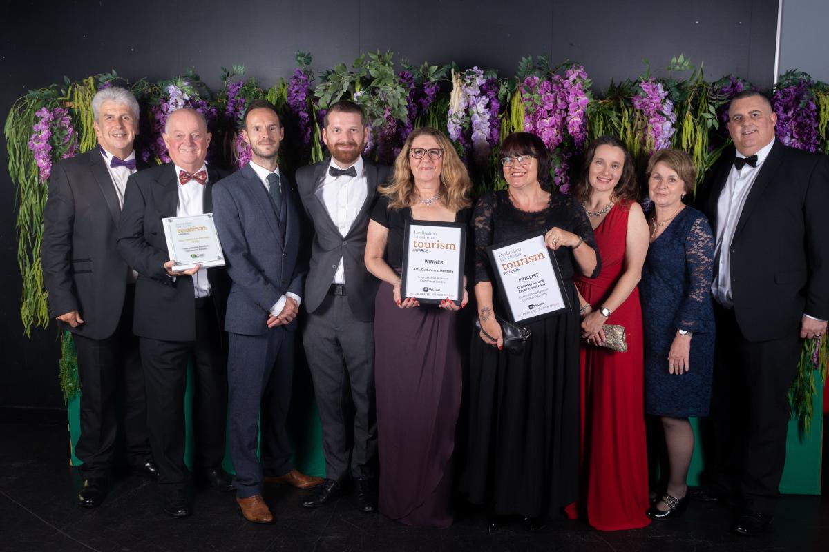 A group of award winners show off their certificates at the Tourism Awards 2023