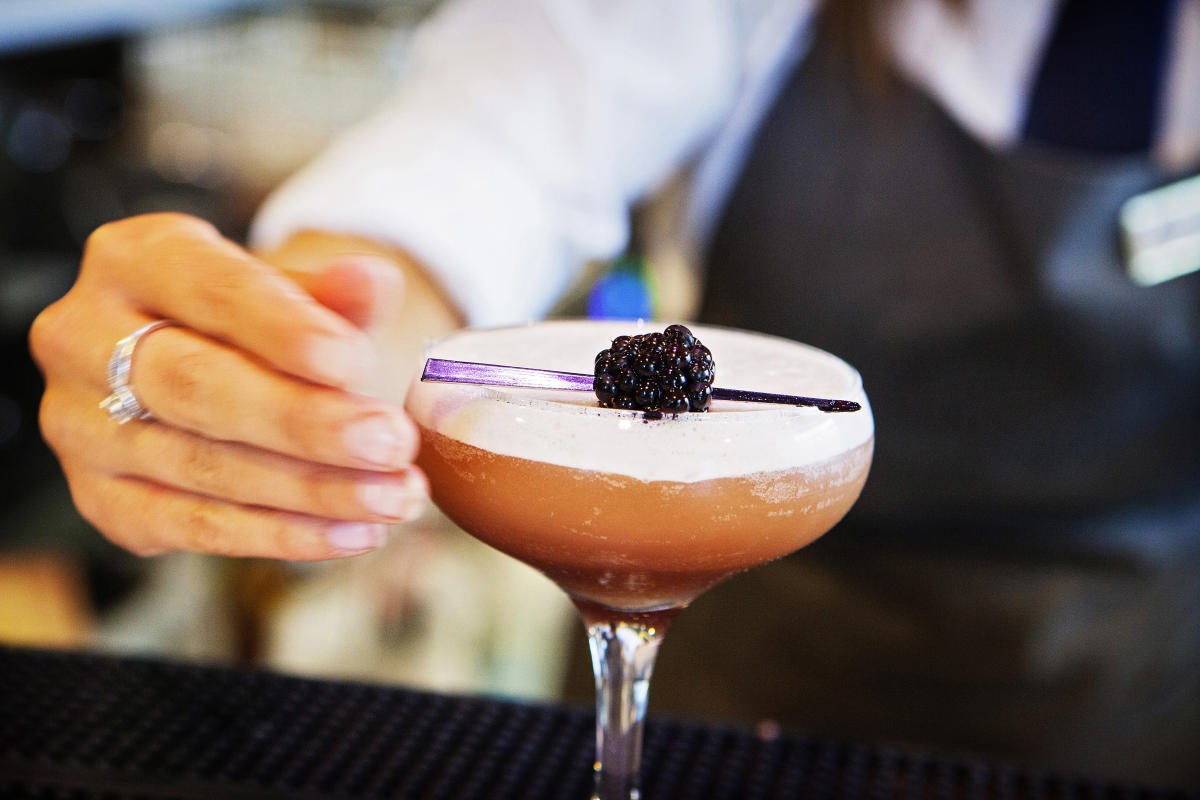 An image of a cocktail being prepared by a skilled bartender at Electric Bar, Lincoln
