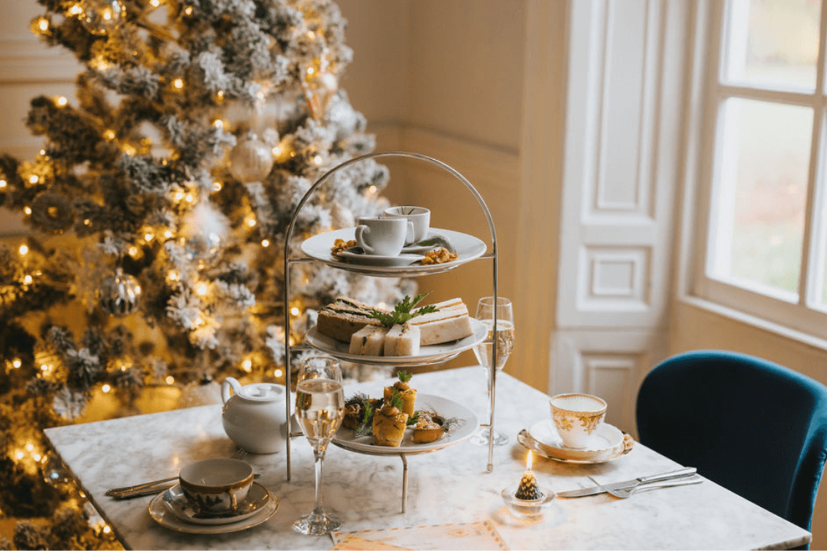 a picture of a restaurant table decorated with deserts and Christmas treats