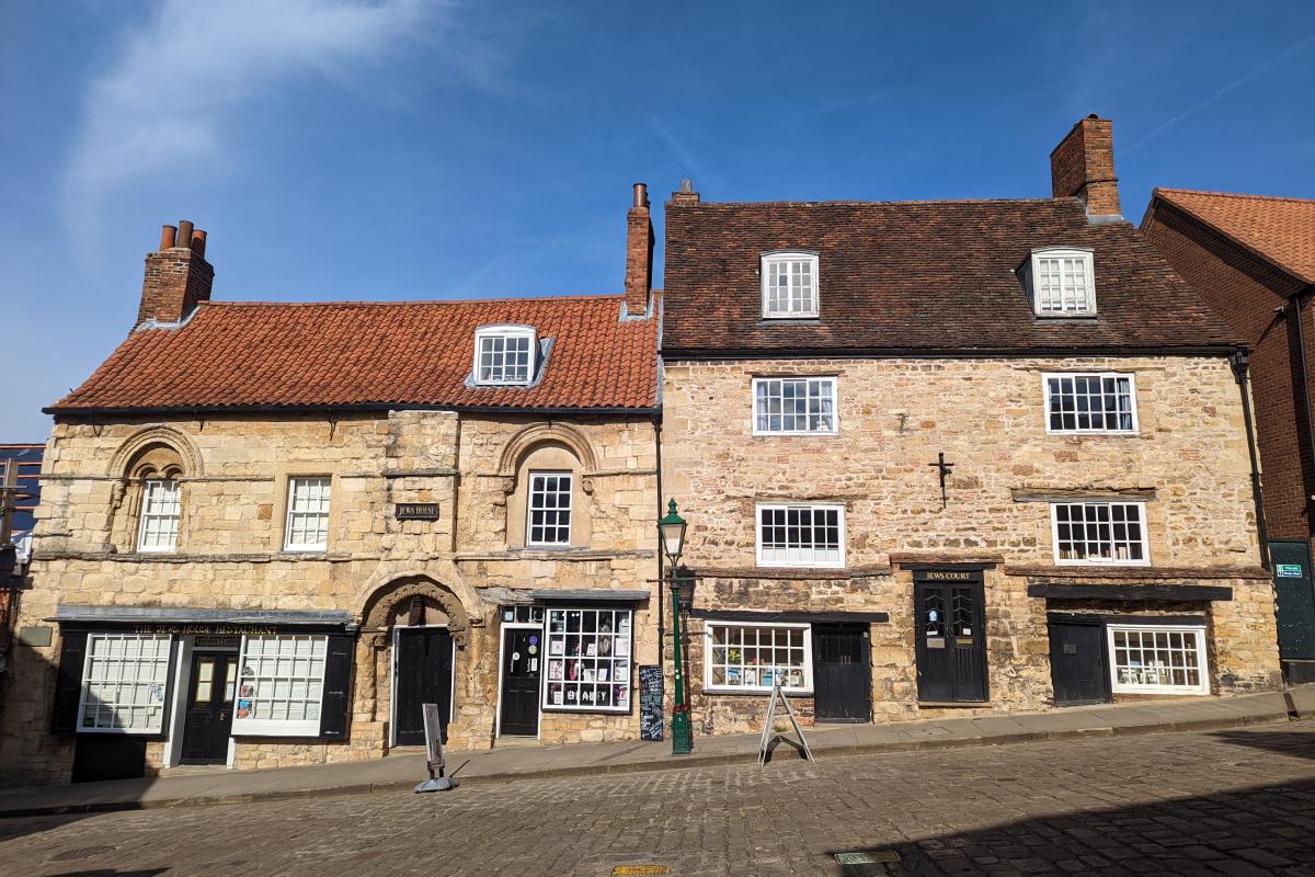 Exterior of Jew's House on Steep Hill in Lincoln with blue sky