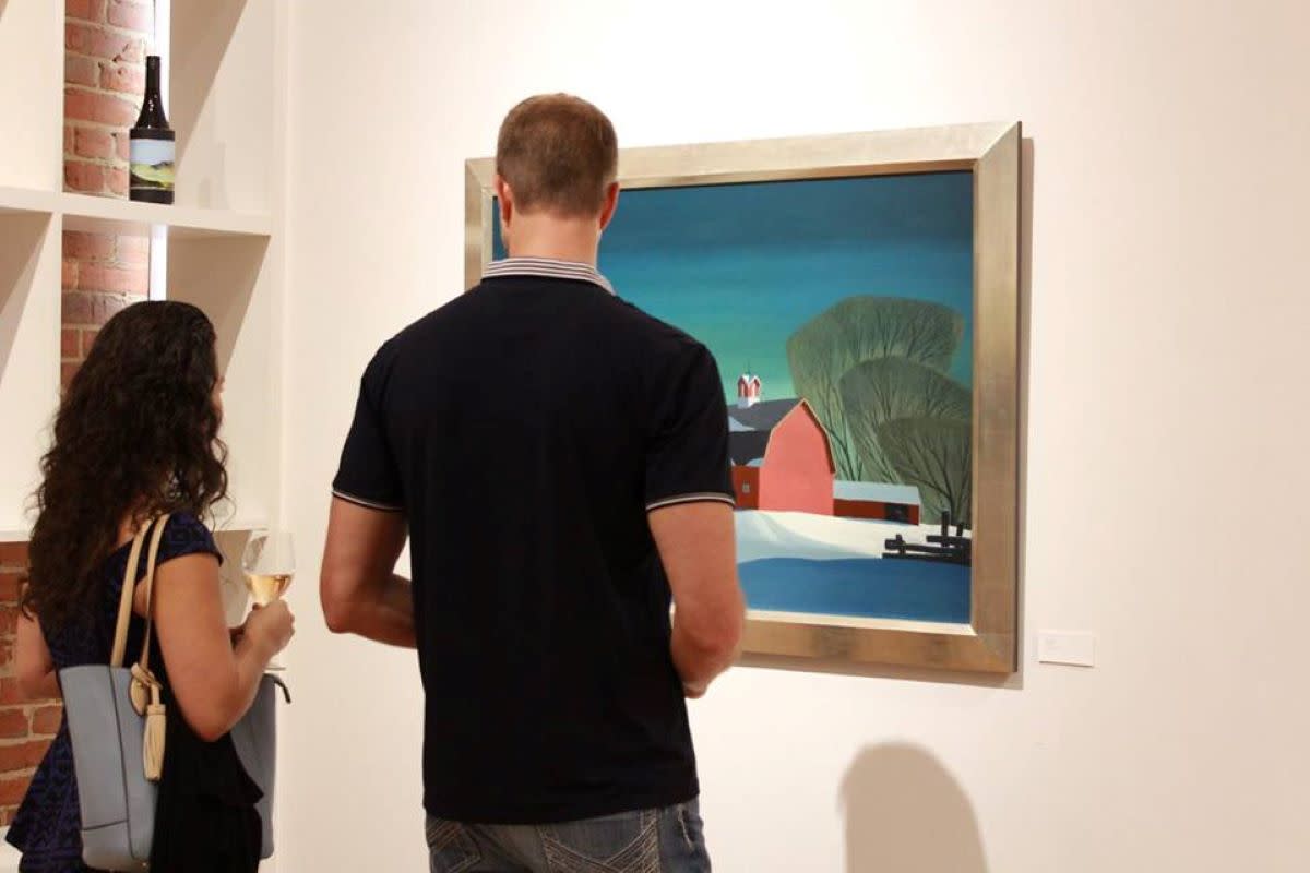 Couple looking at art in gallery