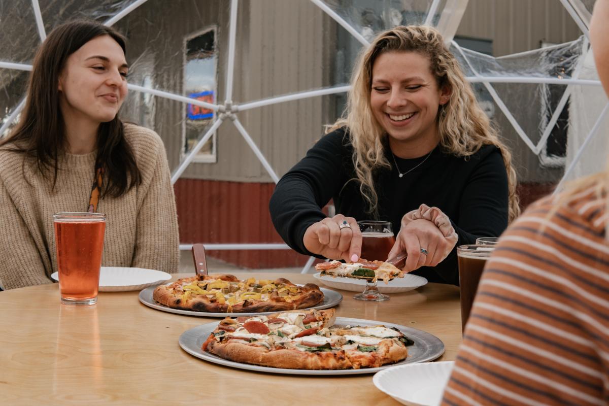 Two Women Eating Pizza