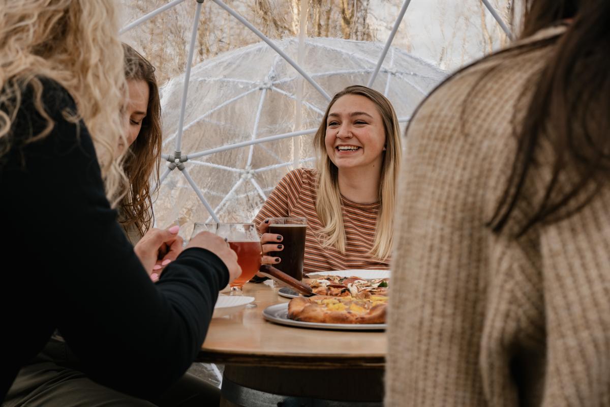 Woman Inside Igloo with Drink