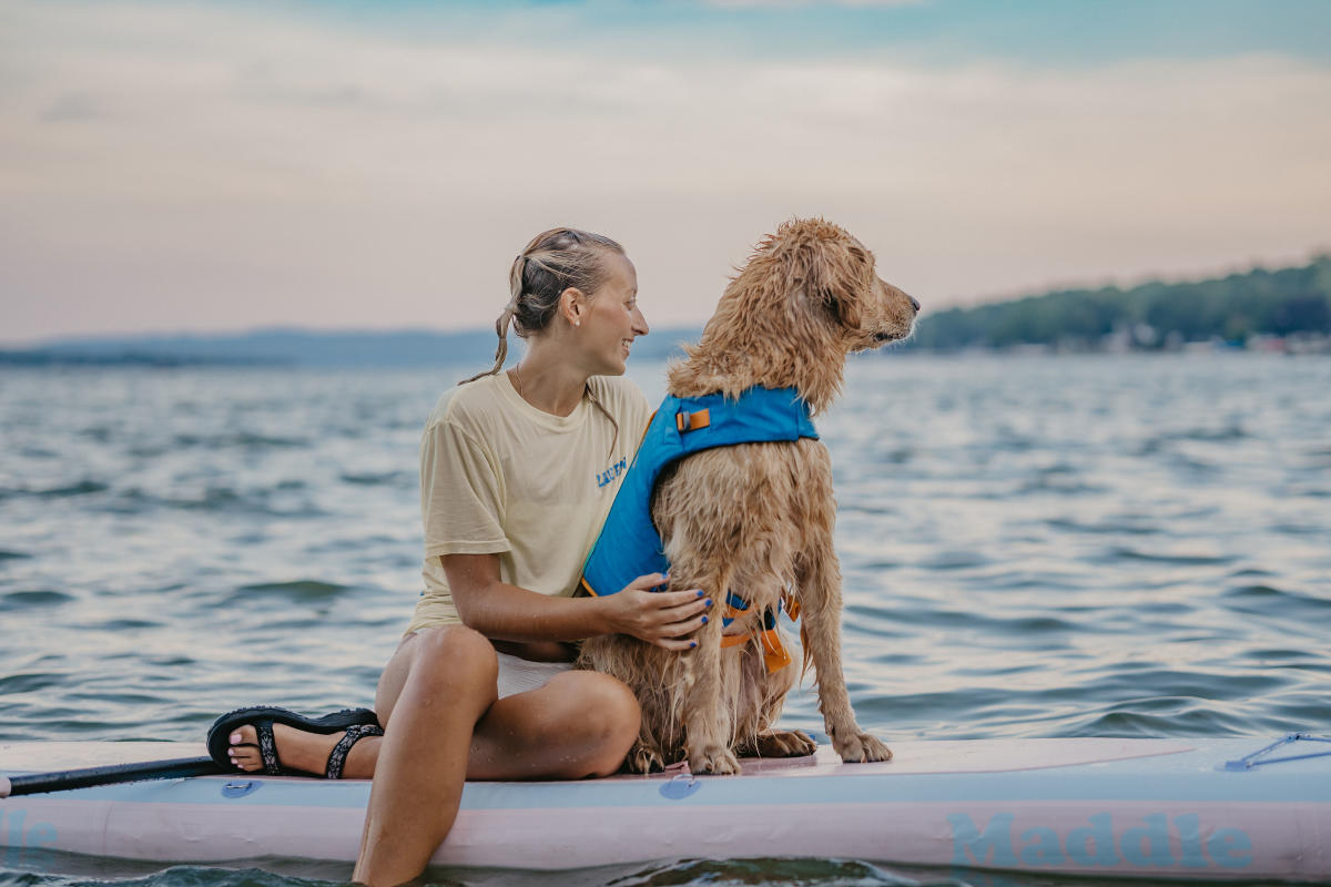 Woman and Dog on Paddleboard