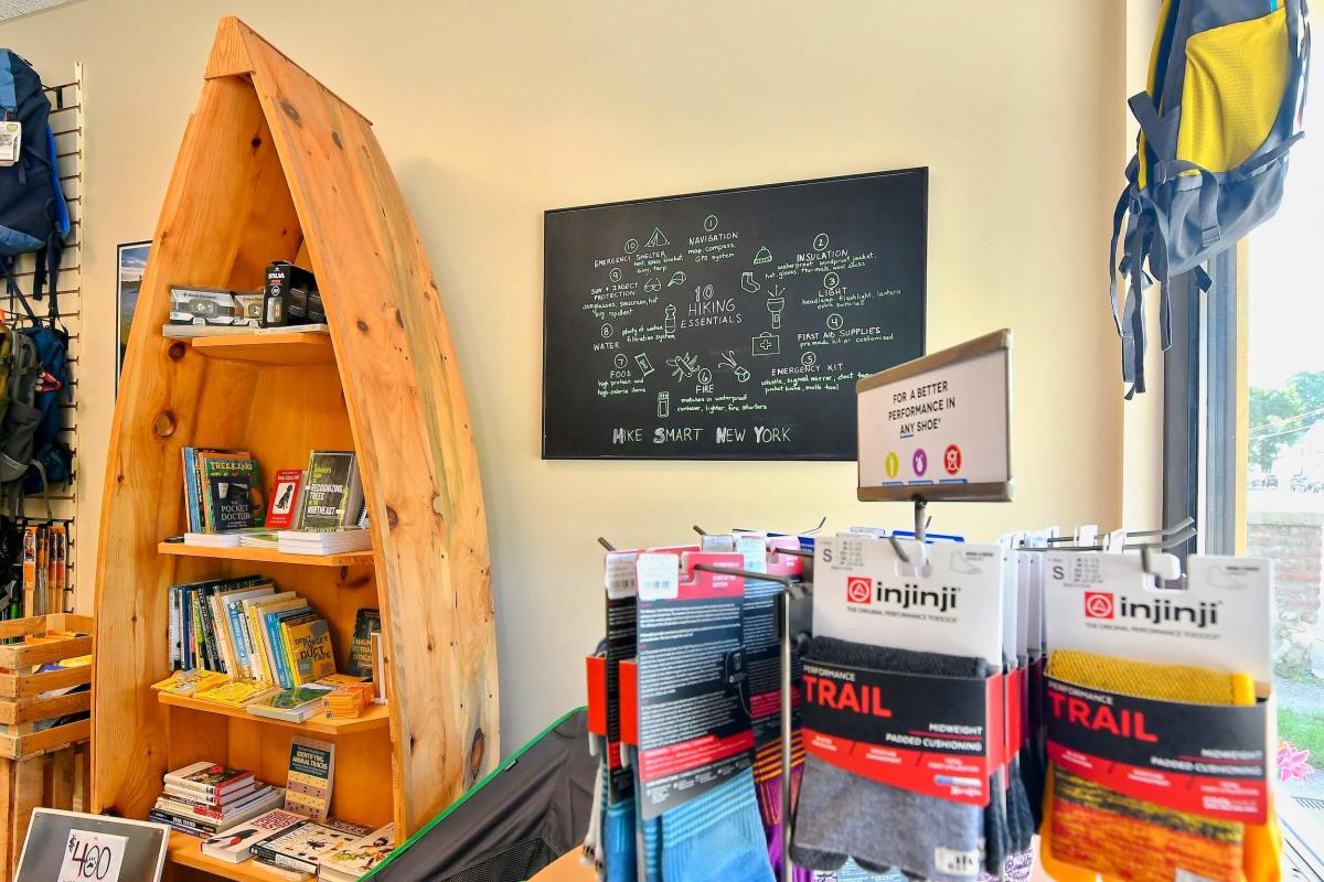 Canoe with books displayed inside store