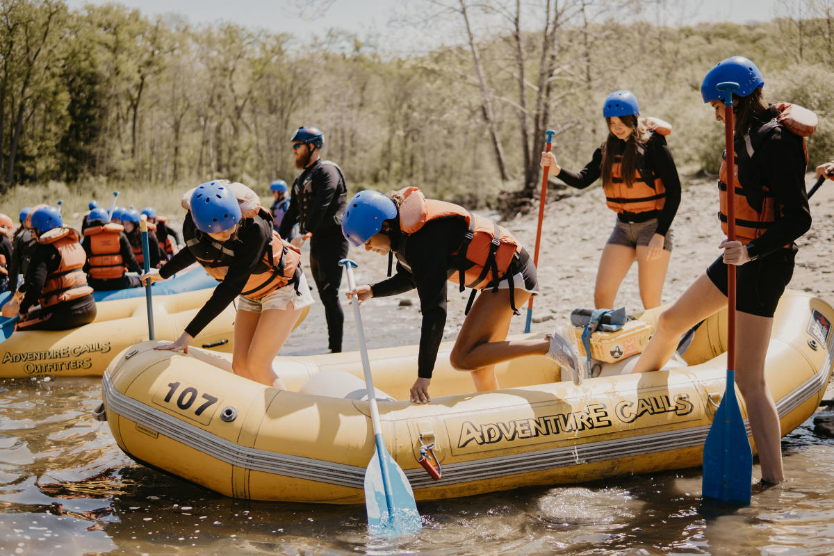 People getting in raft with Adventure Calls