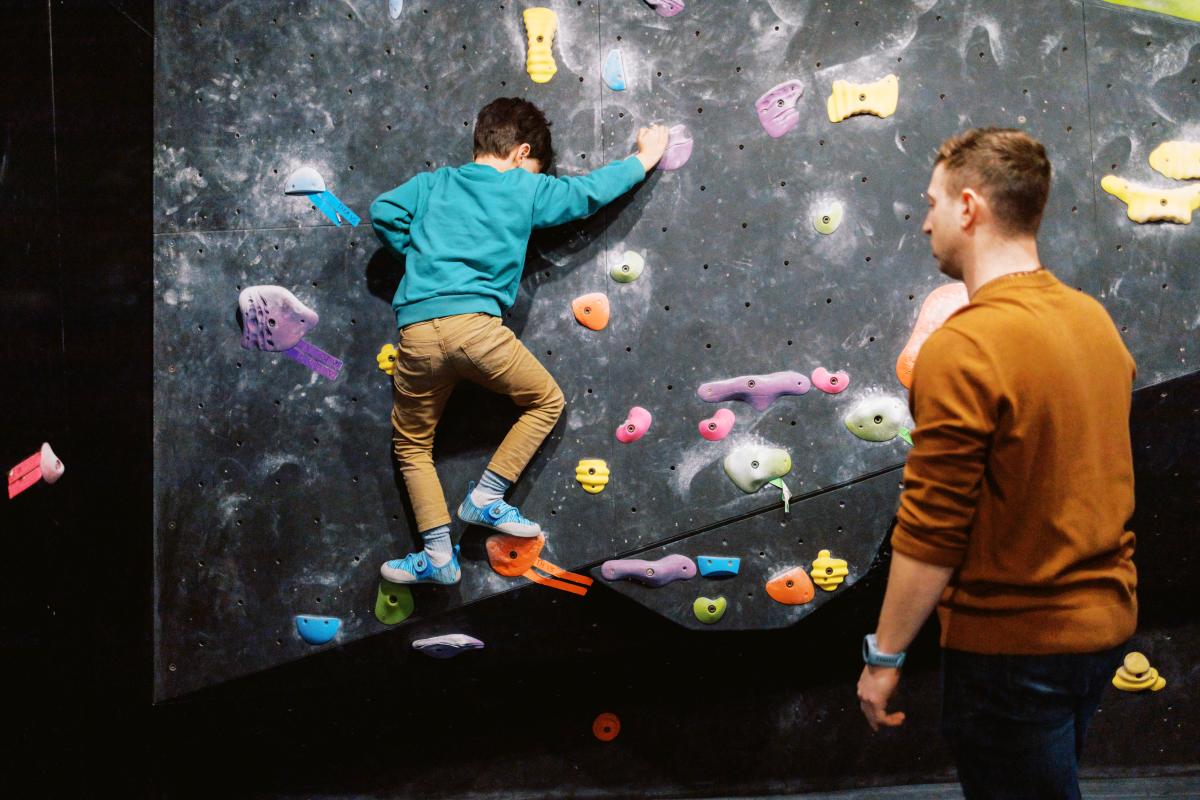 Kid Climbing at Sunrise
