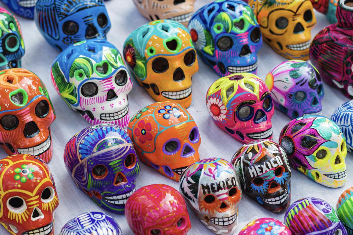 Rows of small, colorfully painted ceramic skulls for Day of the Dead celebrations