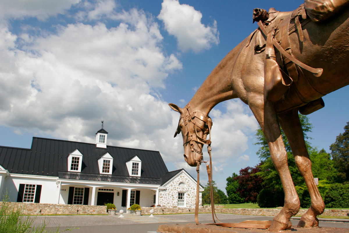 Bronze horse sculpture in foreground outside the National Sporting Library and Museum in Middleburg, Loudoun