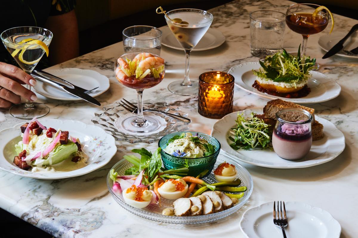 A table filled with drinks and appetizers