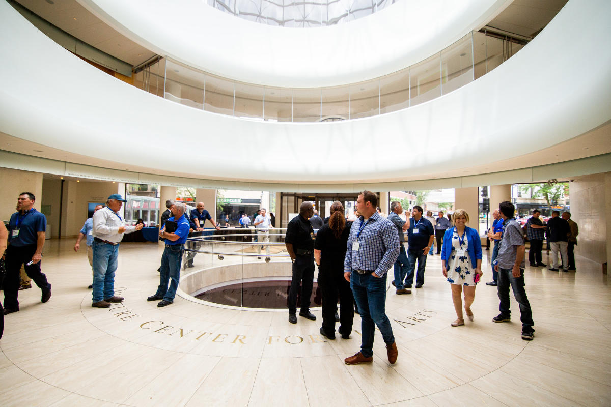 People socialize in the Overture Center rotunda.