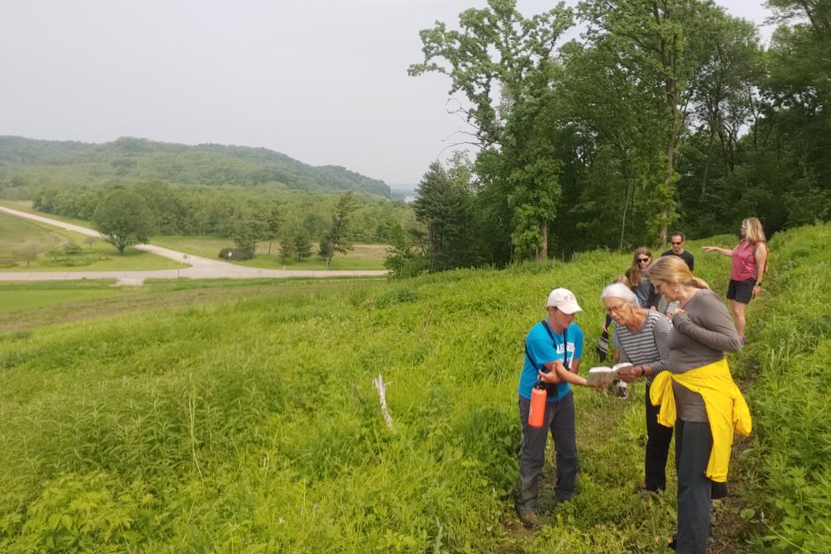 A guide shows hikers on the Welsh Hills Trails an item in a guide book