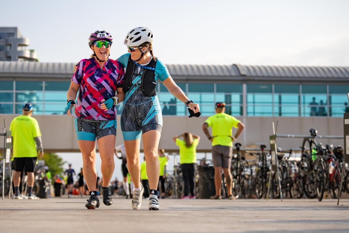 Two IRONMAN participants walking outside