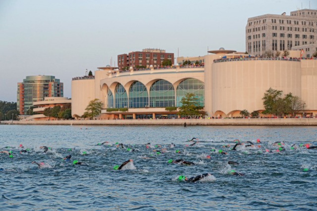 Swimmers in Lake Monona during IRONMAN Wisconsin with Monona Terrace in the background