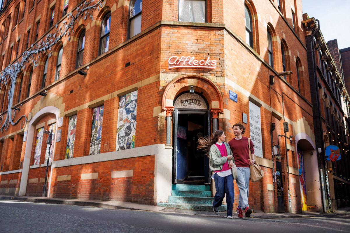 Exterior shot of a couple outside of Afflecks in the Northern Quarter.