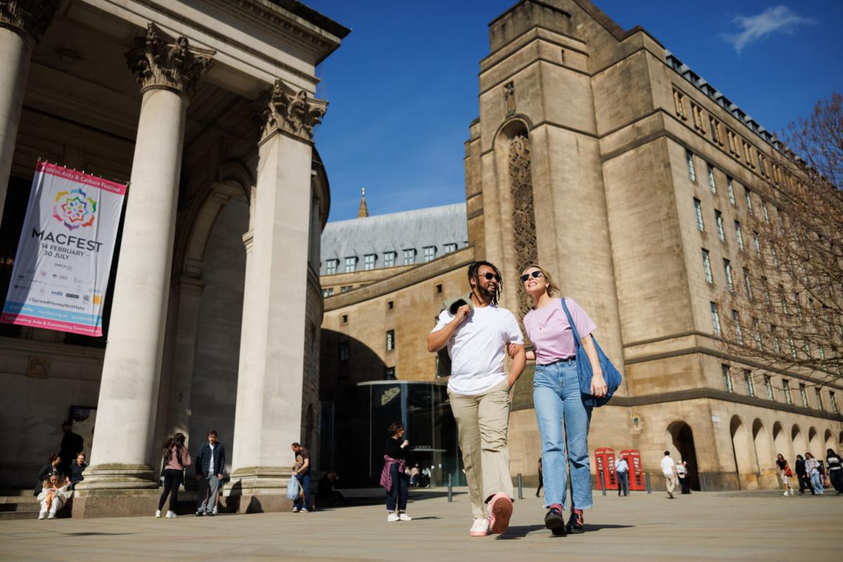 Exterior shot of a couple outside of Central Library, St Peter's Square.