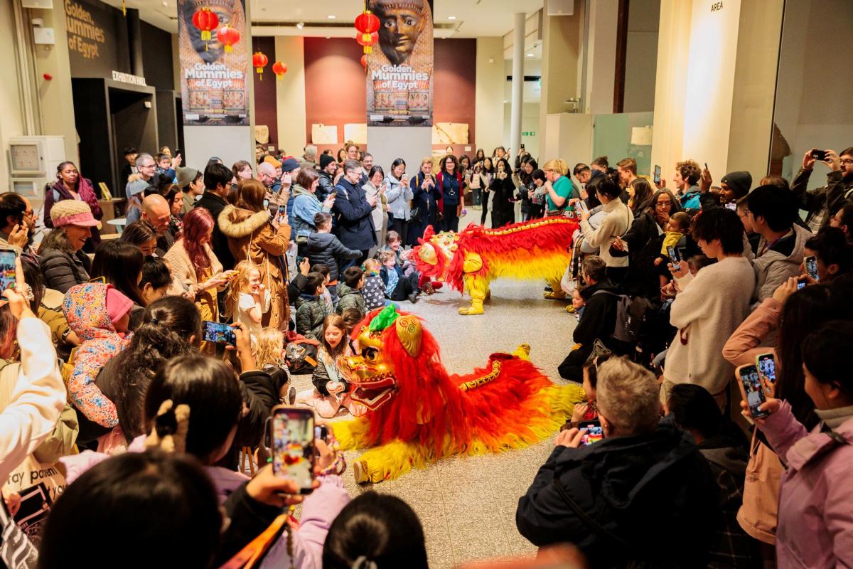 Group of dancing celebrating Lunar New Year at Manchester Museum