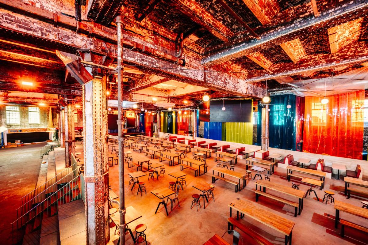 Indoor food hall with empty tables