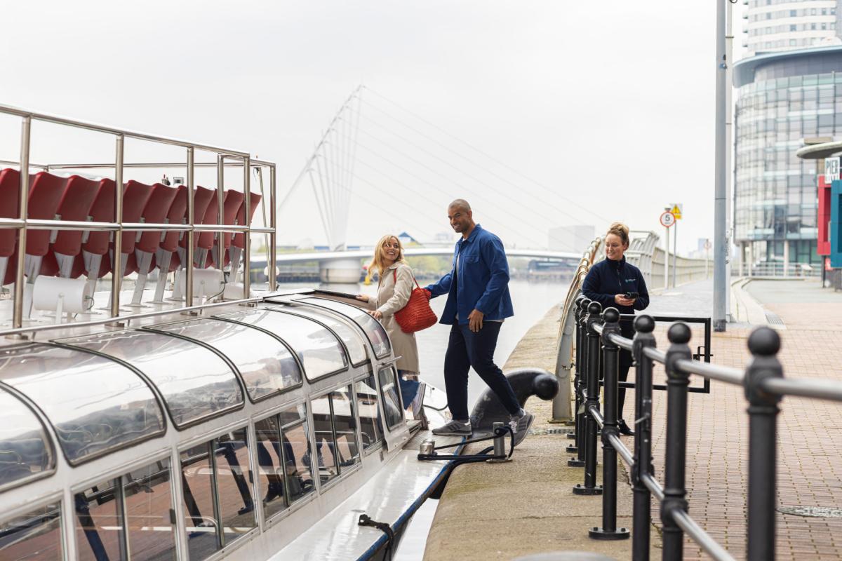 2 people boarding boat at MediaCity UK