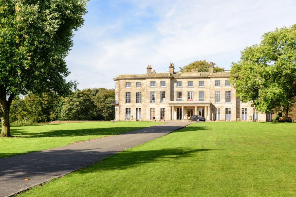 Grand Haigh Hall in Wigan in the sun with garden