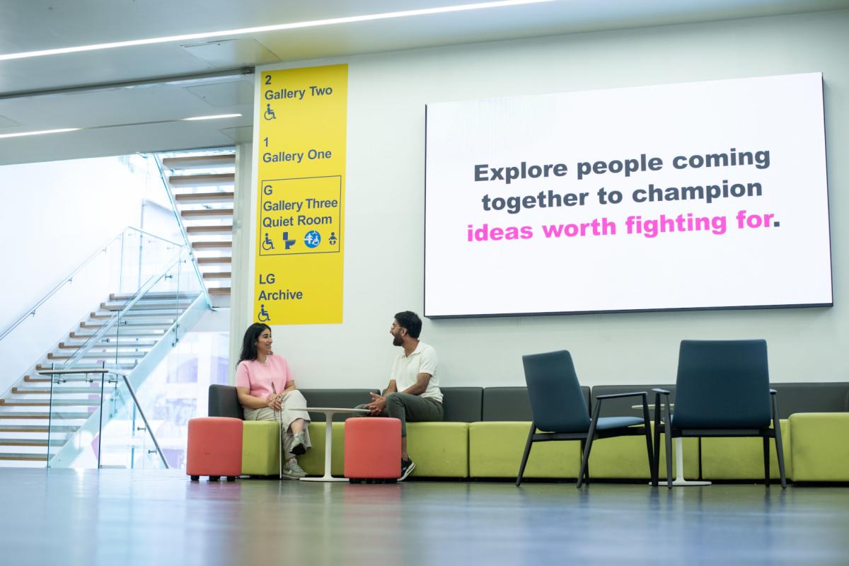 2 people sat on chairs at People's History Museum