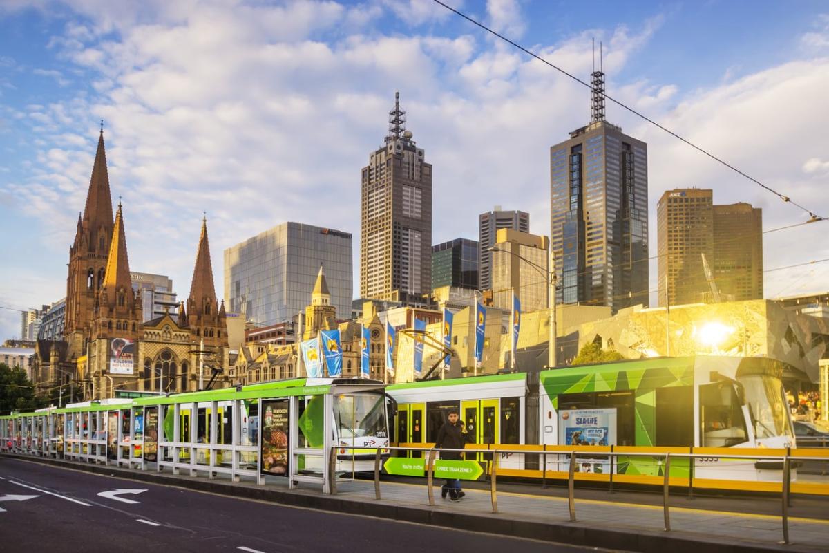 Melbourne tram with city skyline in background