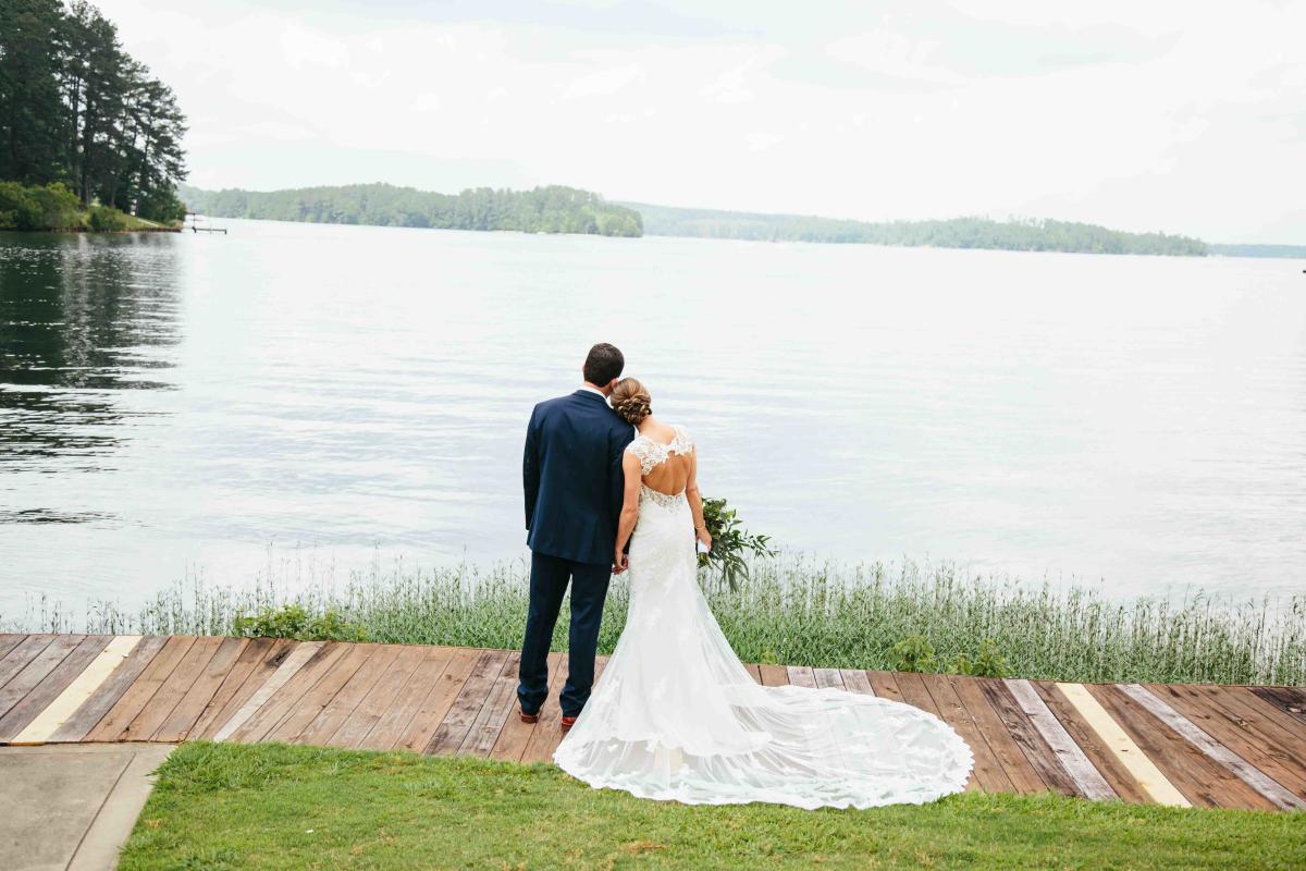 Bride And Groom Looking Out Over A Lake In Milledgeville, GA