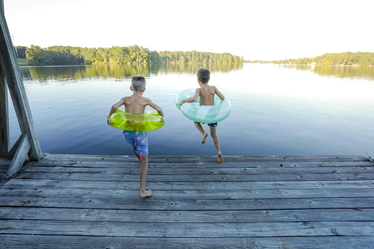 Lake Sinclair boys jumping with floats