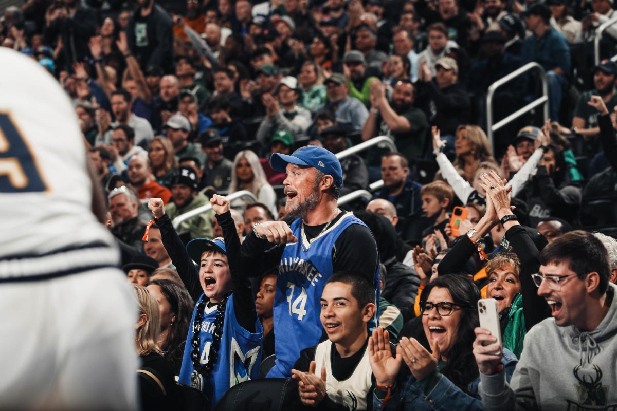 Fans of the Milwaukee Bucks cheer on their home town team at Fiserv Forum.