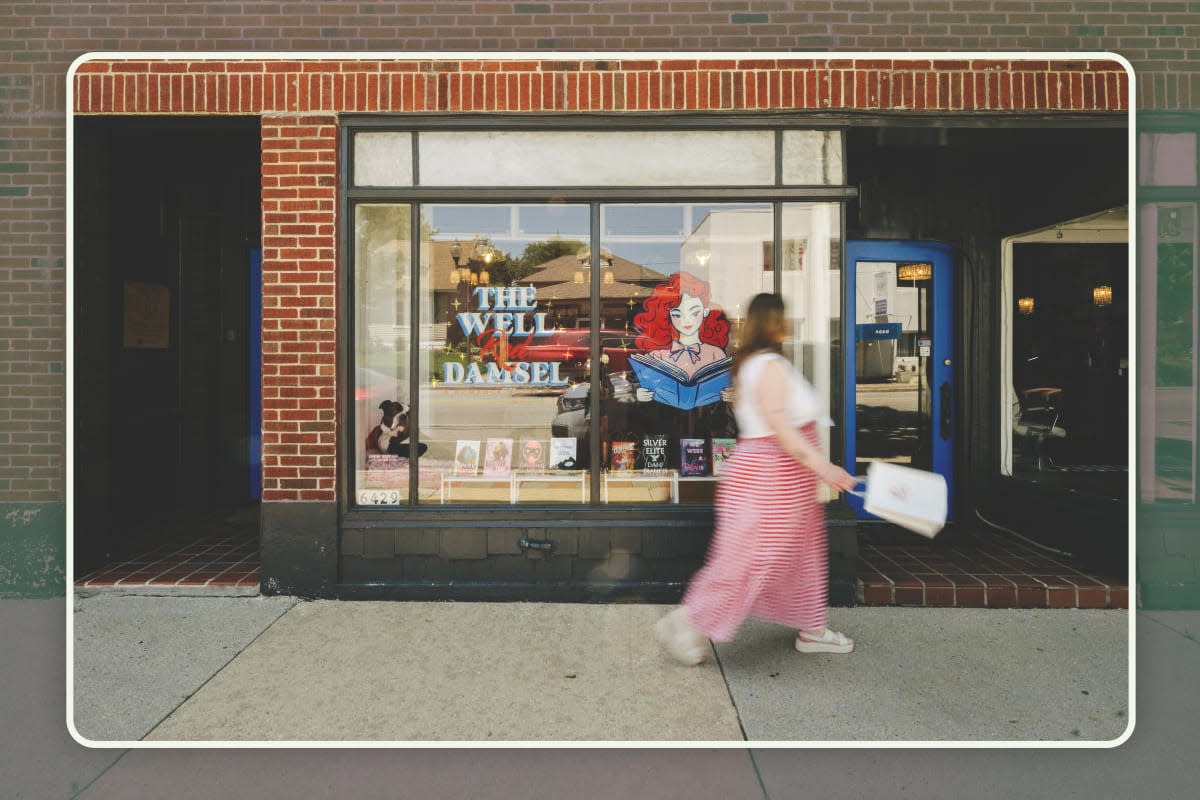 A woman walking in front of The Well Read Damsel