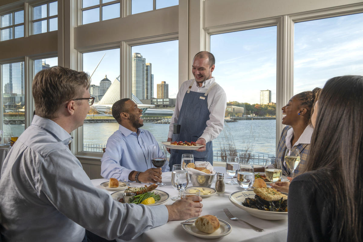 Interior-Server delivering Food to Window Table