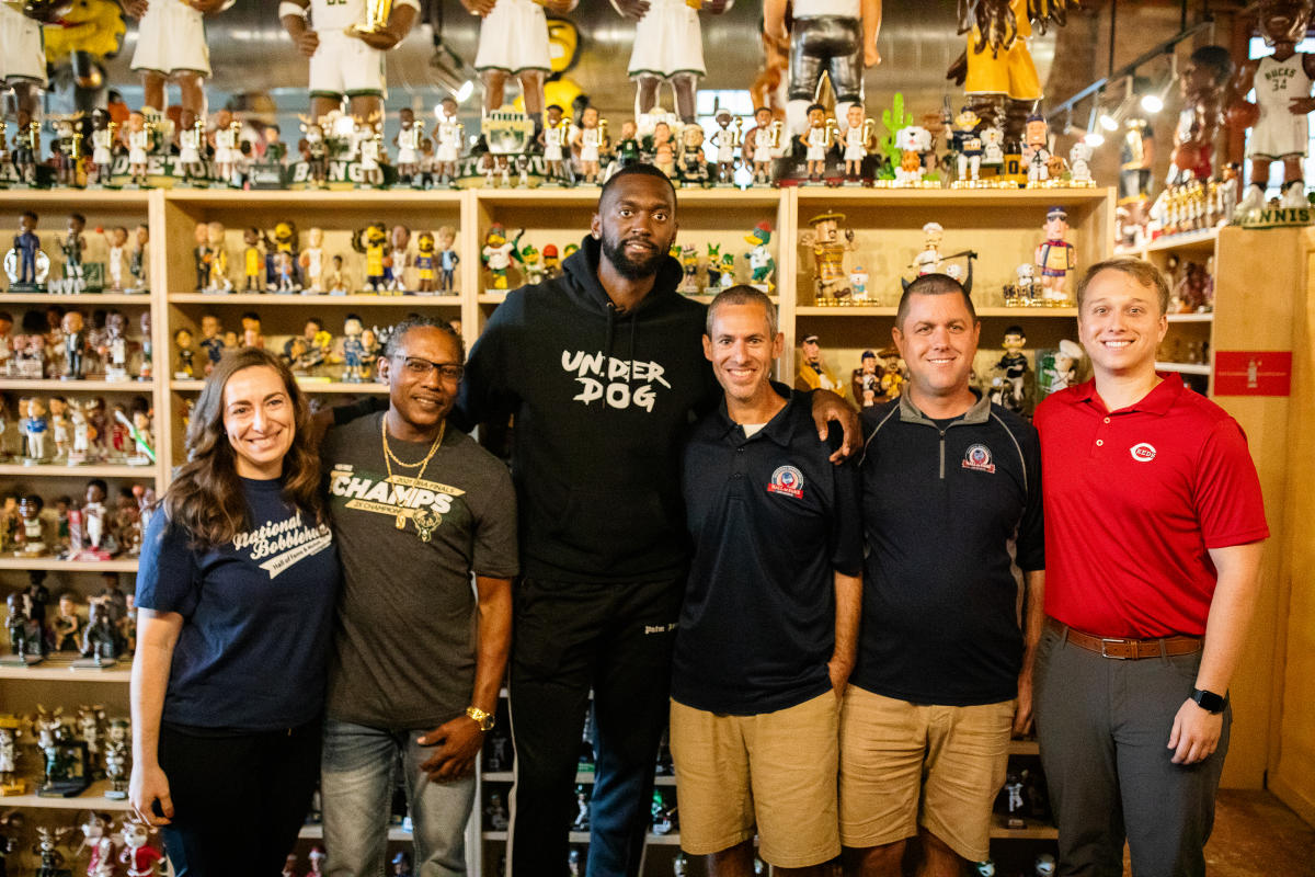 Bobby Portis with the staff of the National Bobblehead Hall of Fame and Museum