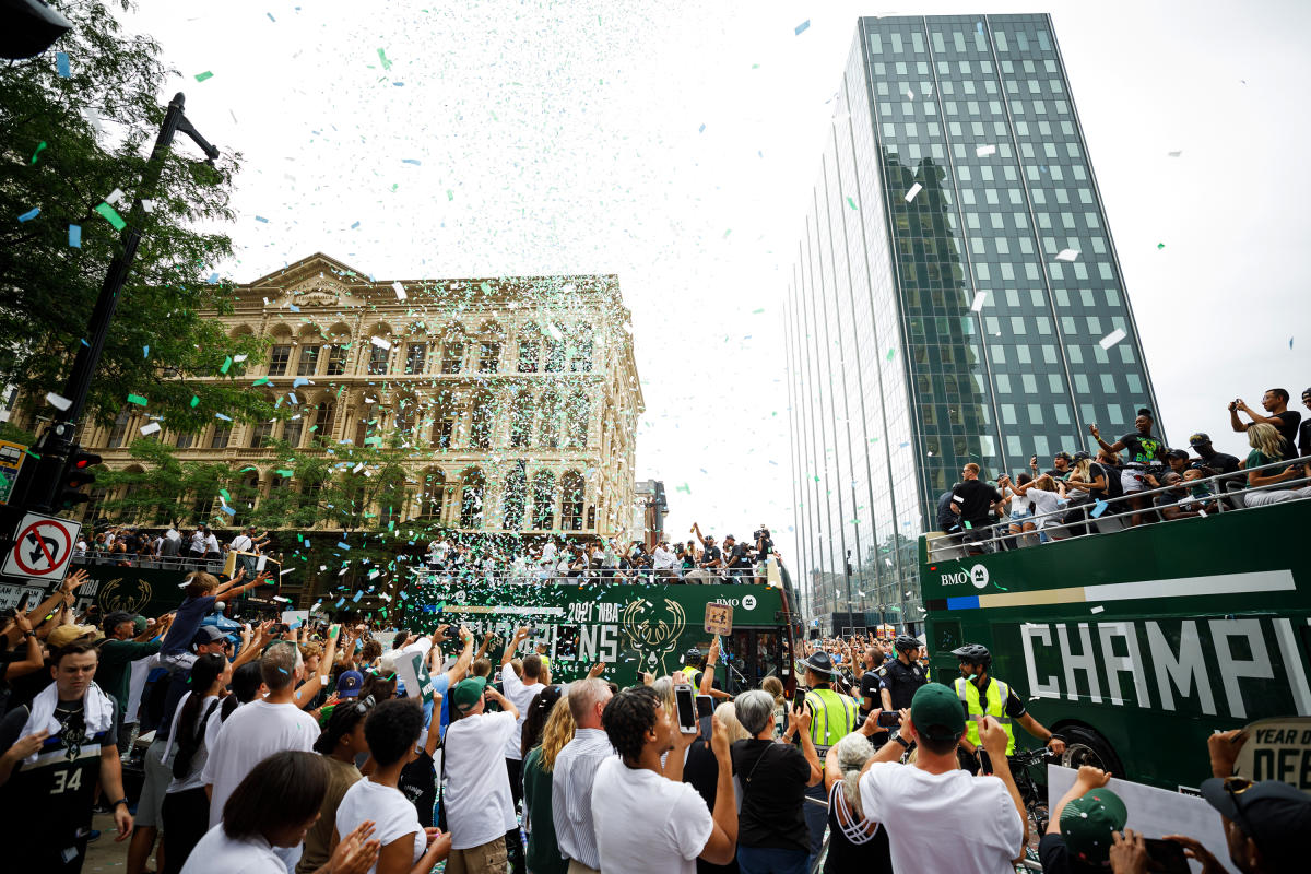 parade floats in the city, confetti in the air