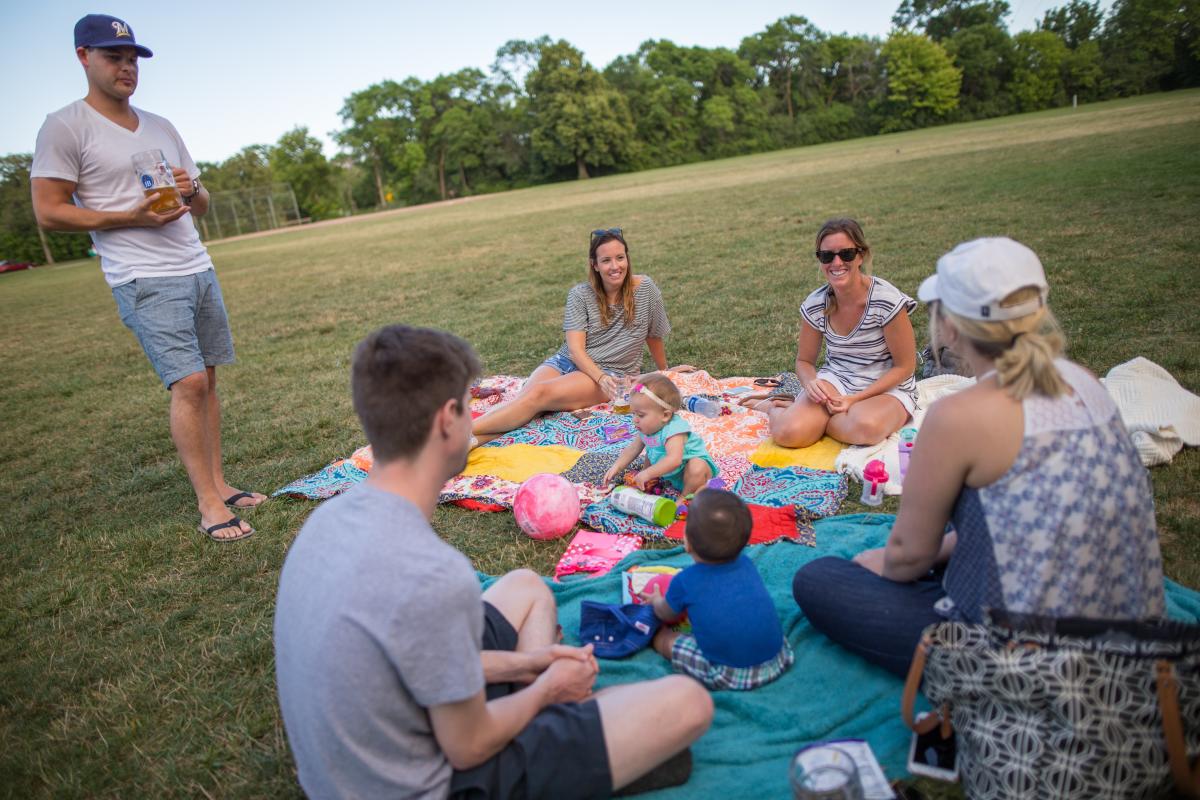 Family at Estabrook Park enjoying a picnic