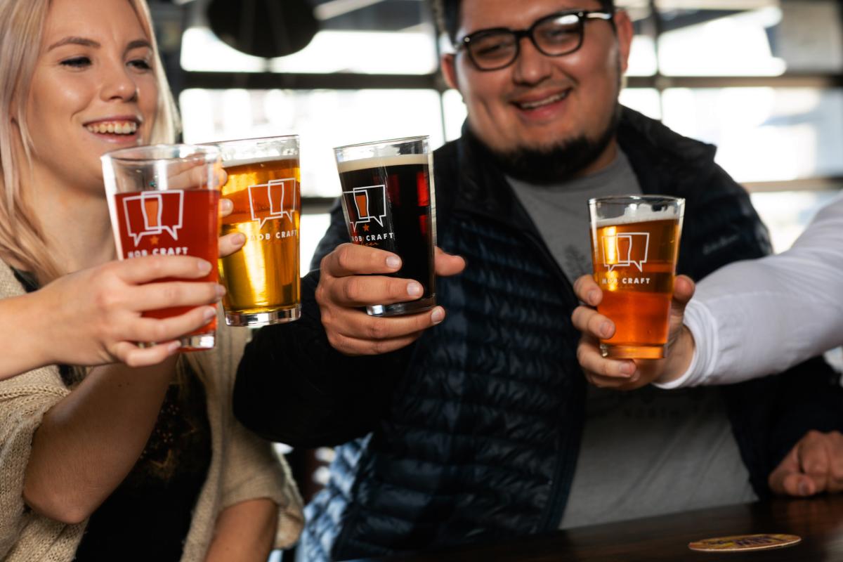 Friends cheersing beers