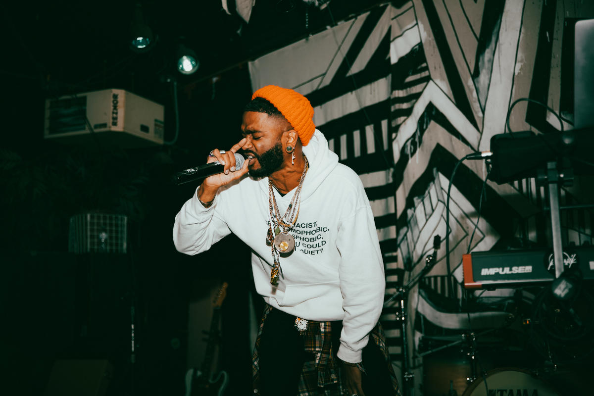 performer singing with mic in hand