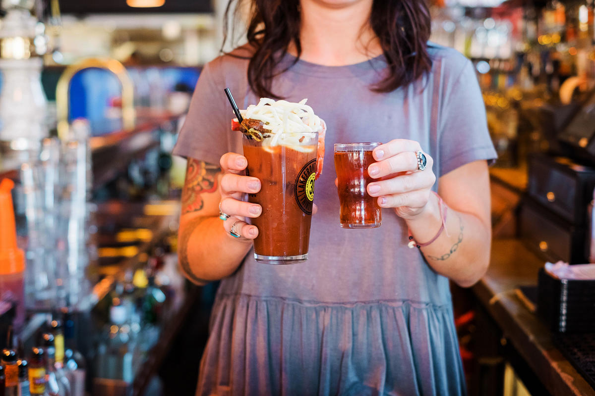 bartender holding bloody mary