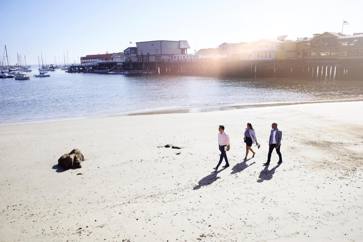 Walking on the beach near Monterey Wharf