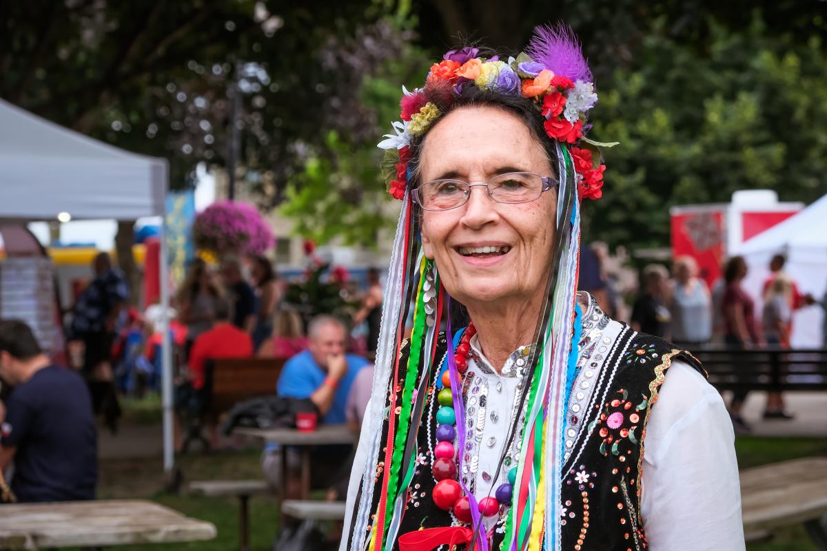 Smiling Woman in Traditional Polish Dress at Muskegon Polish Festival