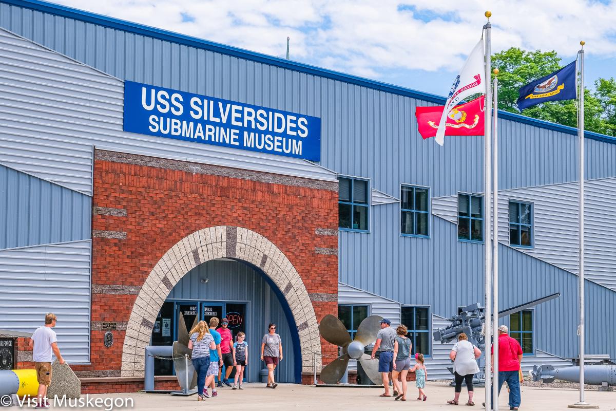 Group of people entering and exiting the USS Silversides Museum Entrance