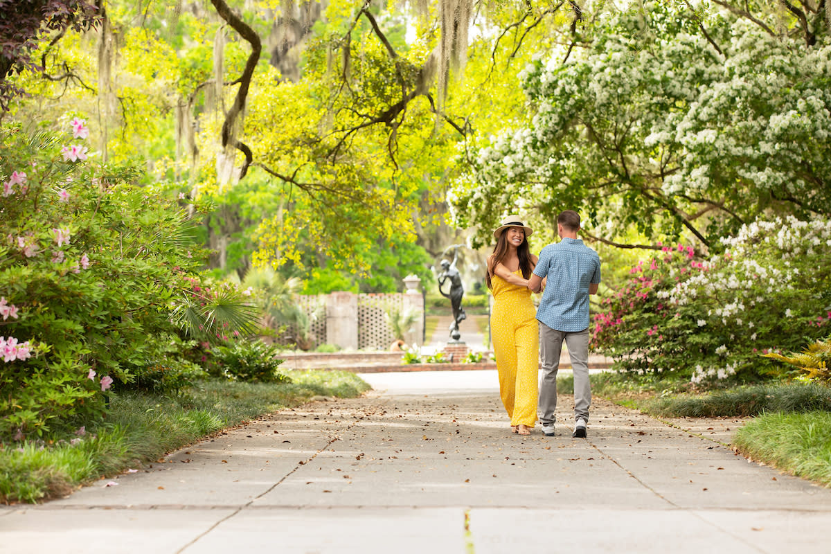 Couple walking through Brookgreen Gardens