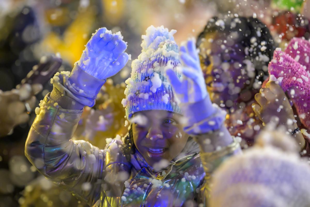 Girl enjoying snow at NDD tree lighting