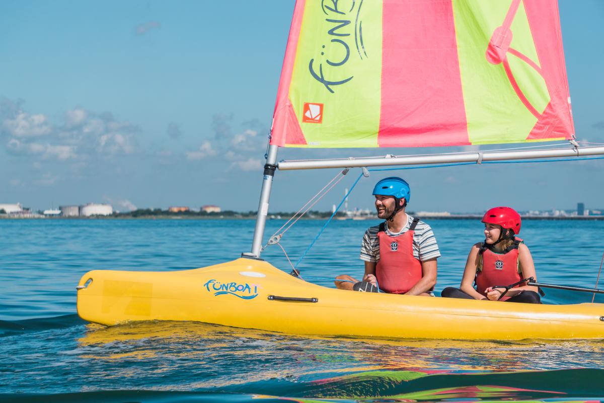2 people sailing in The Solent with Calshot Activities Centre in the New Forest