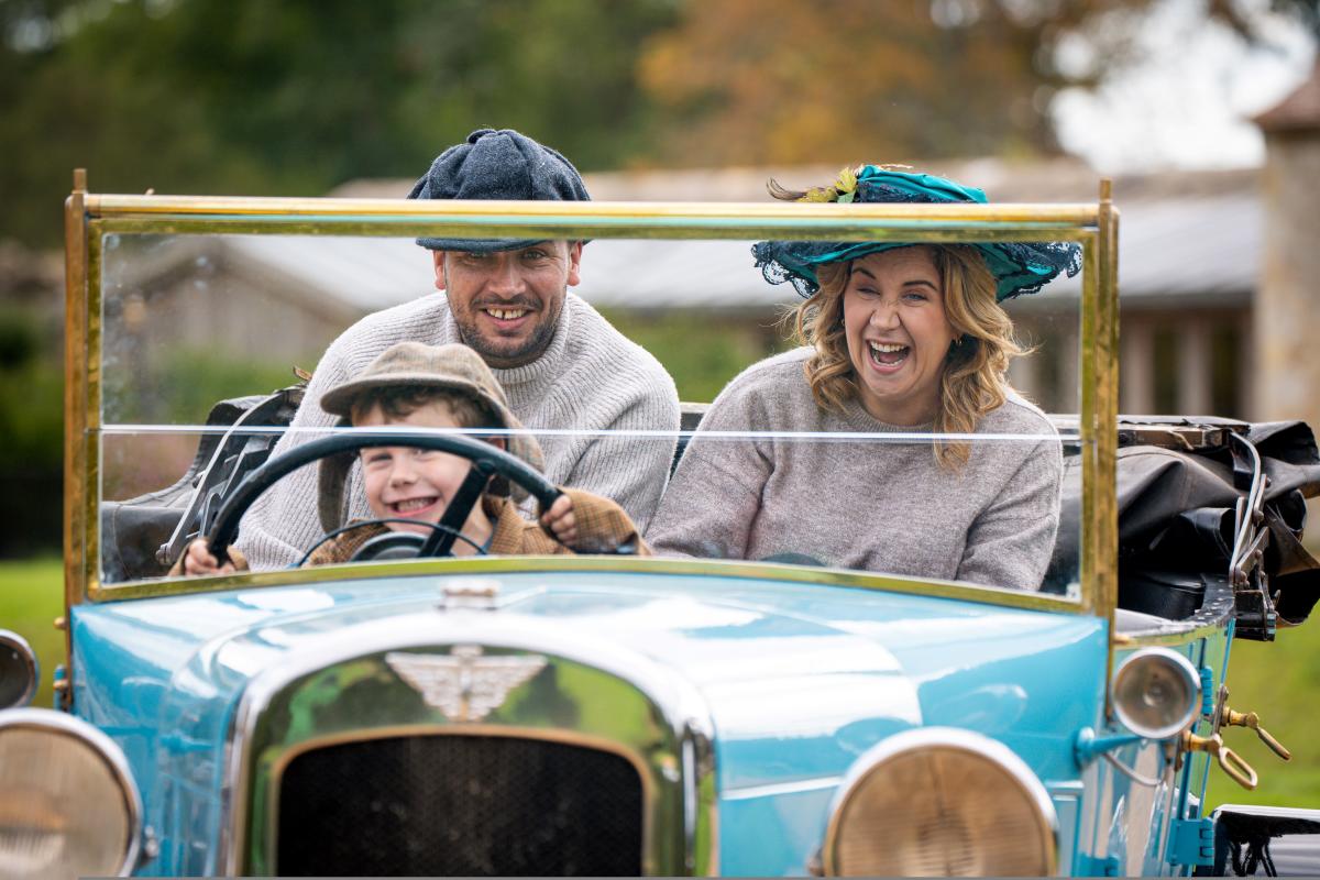 Beaulieu National Motor Museum - people in car outside