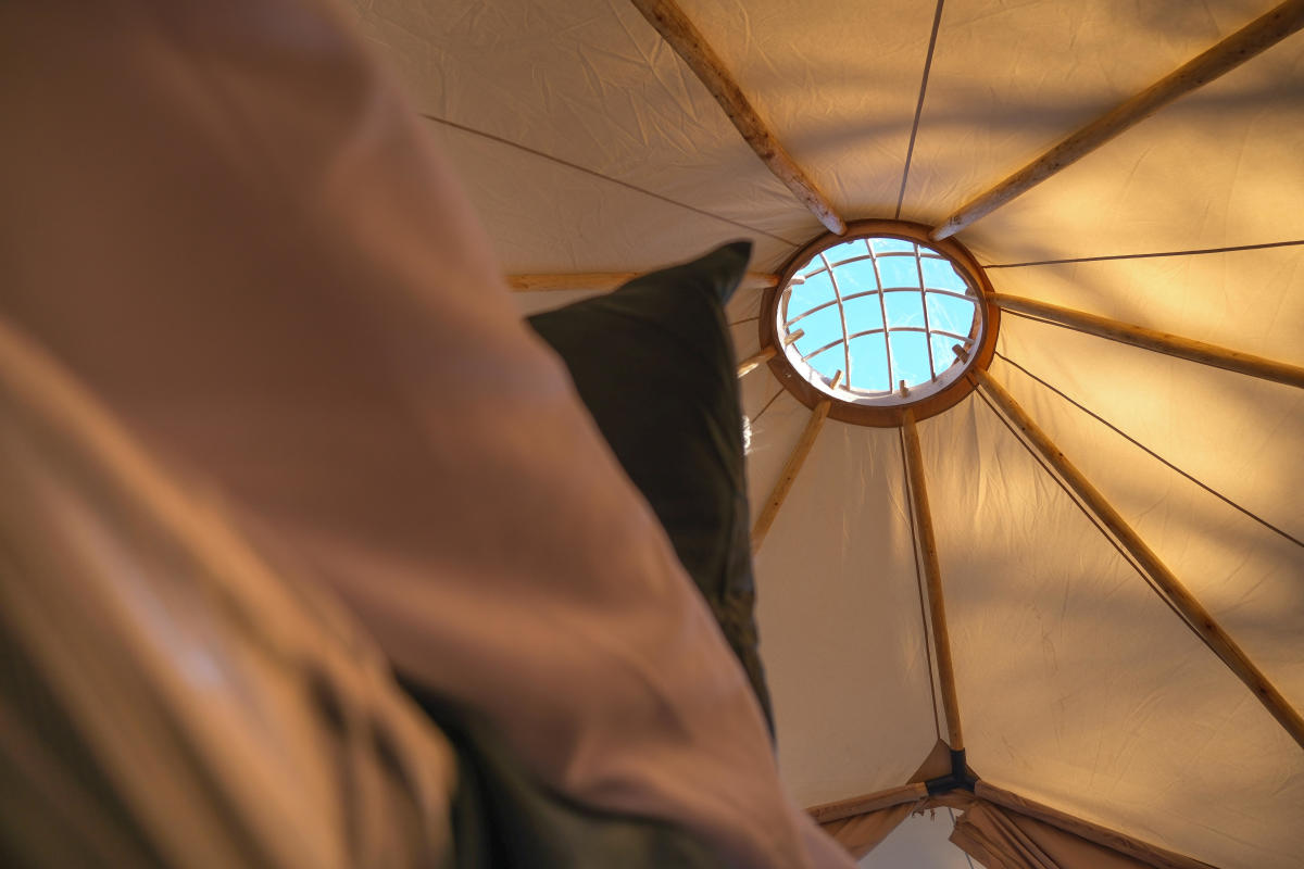 Inside glamping tent looking up at roof