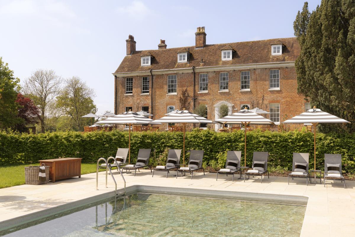 Outdoor Pool at New Park Manor Hotel with striped umbrellas