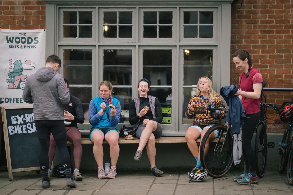 People sitting outside The Woods Cyclery in Lyndhurst in the New Forest