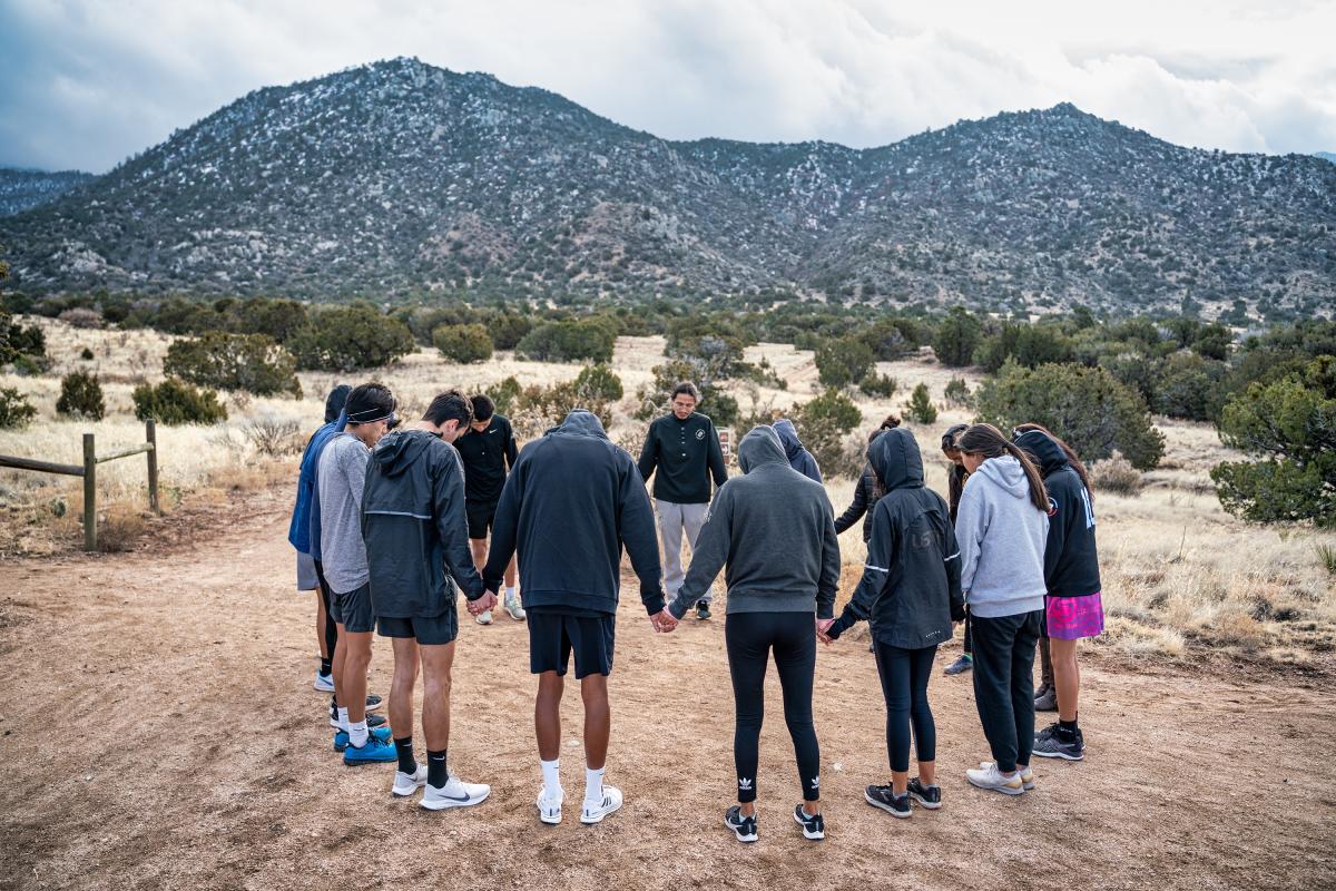Team blessing of runners in Albuquerque